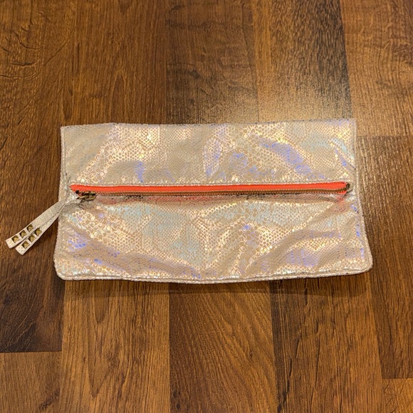 American Eagle Outfitters Handbags - American Eagle Iridescent Metallic Fold-Over Clutch with Coral Zipper